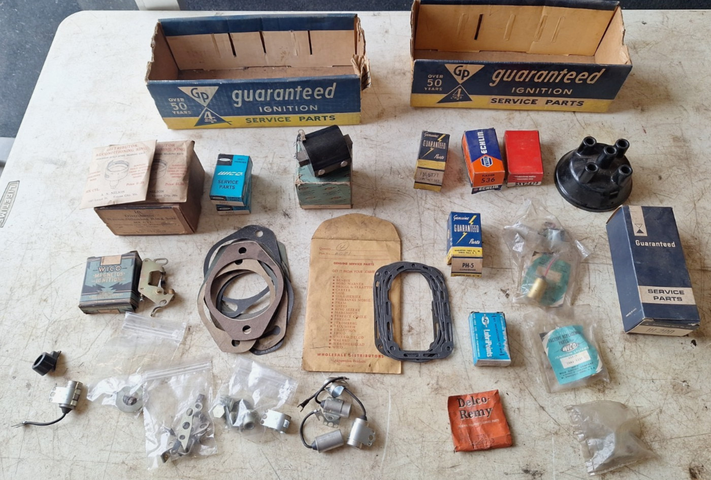 VINTAGE IGNITION PARTS BOXES WITH SOME NOS IGNITION PARTS