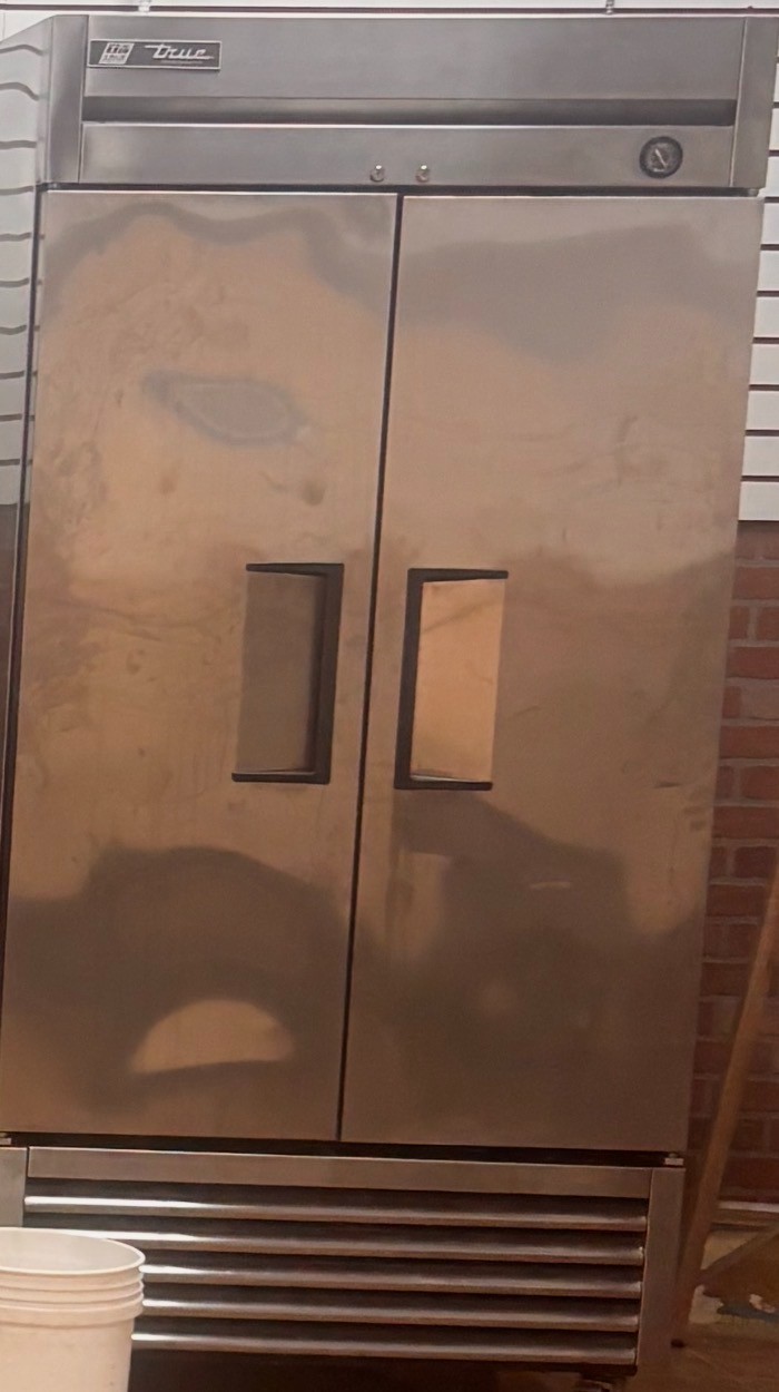 TRUE - commercial double door refrigerator - used - Excellent condition on wheel