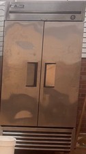 TRUE - commercial double door refrigerator - used - Excellent condition on wheel picture